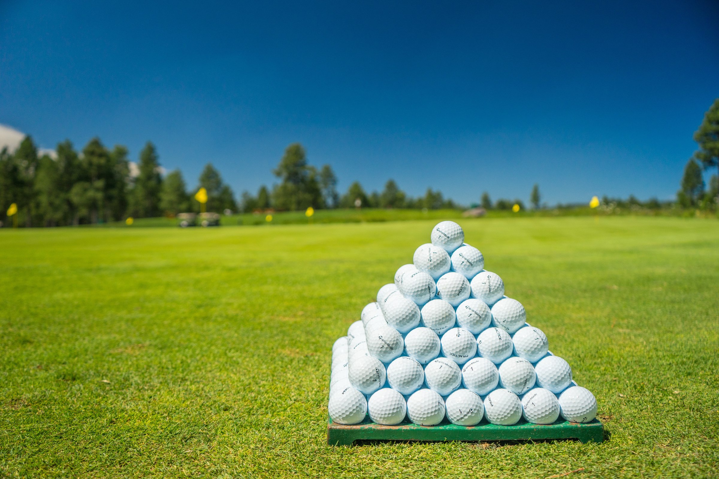 Piled Golf Balls in a Golf Course